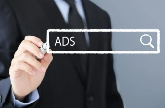 Businessman in a suit drawing a search bar with the word ads on a transparent screen, representing digital advertising and marketing strategy.