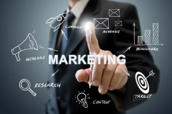 Businessman in suit pointing at virtual screen with marketing icons such as megaphone, target, research, and growth chart.