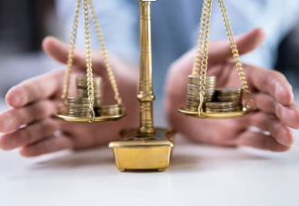 Close-up of a golden balance scale with coins on both sides and blurred hands in the background representing decision-making between business growth and contentment.