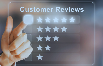 Hand pointing at customer reviews with star ratings on a digital interface.
